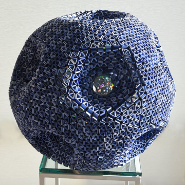 A snapology origami sculpture of an 11-holed Torus, assembled by David Honda. Image Credit: Yana Mohanty.